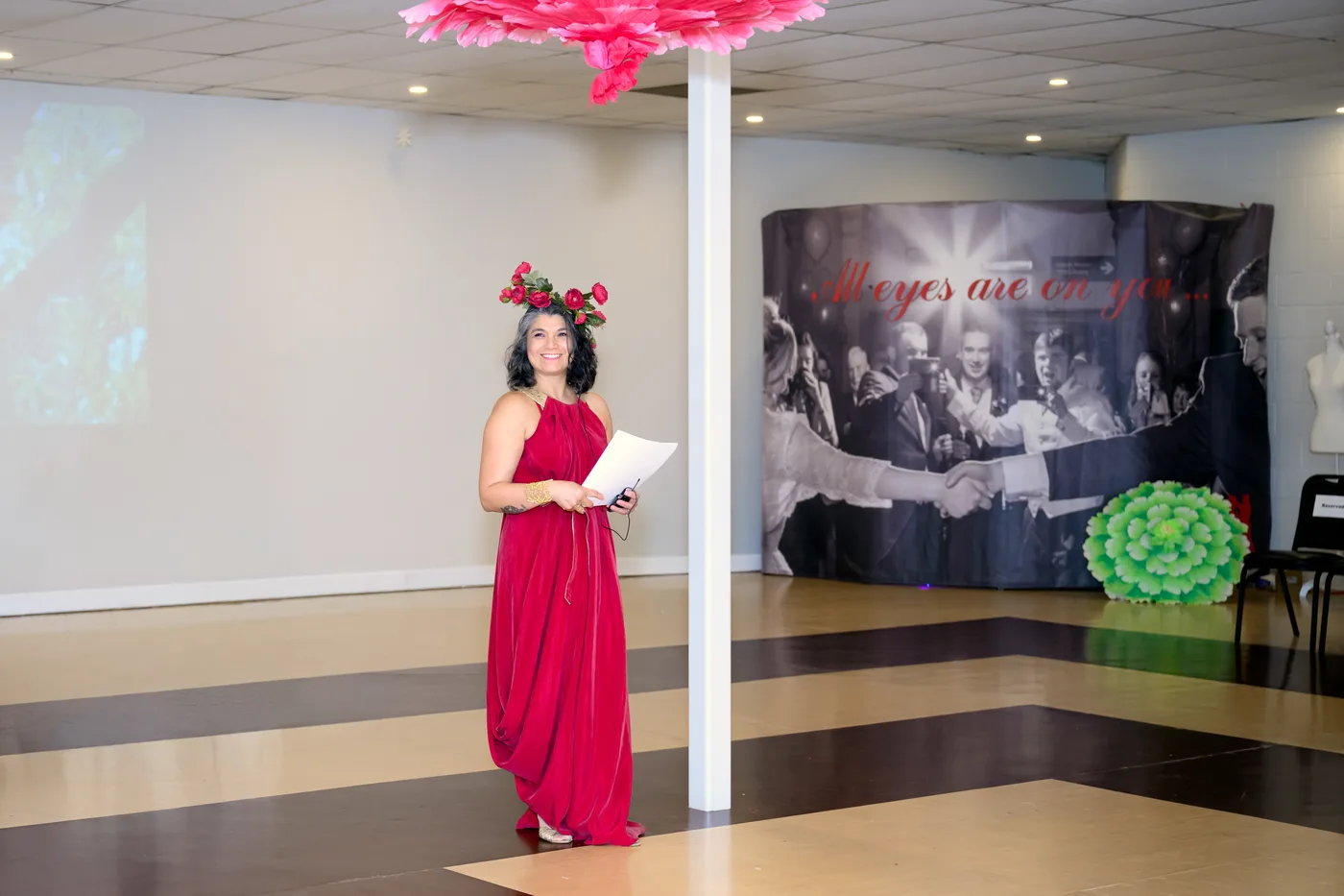 The show's host introducing the collections on the runway